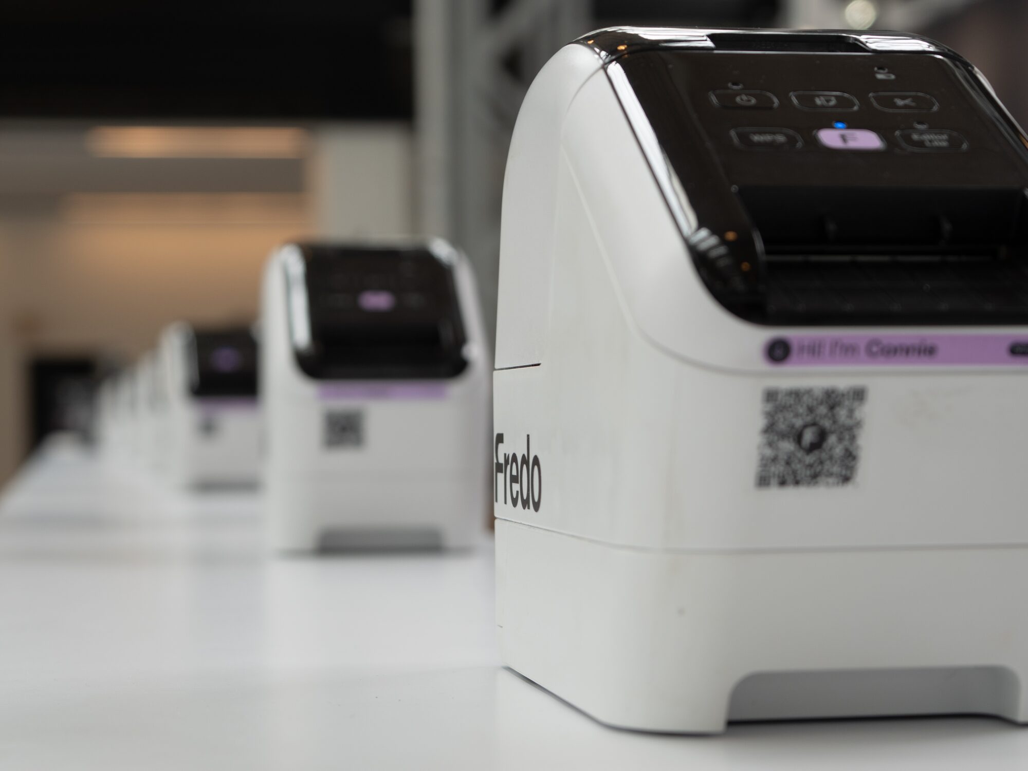 Fredo name badge printers and check-in setup at an event