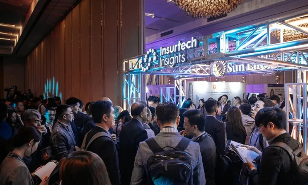 Attendees arriving at the Insurtech Insights conference entrance